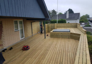 Bigger wooden deck build entirely with GroundPlug® TwisterTM Screw Pile Foundations.
