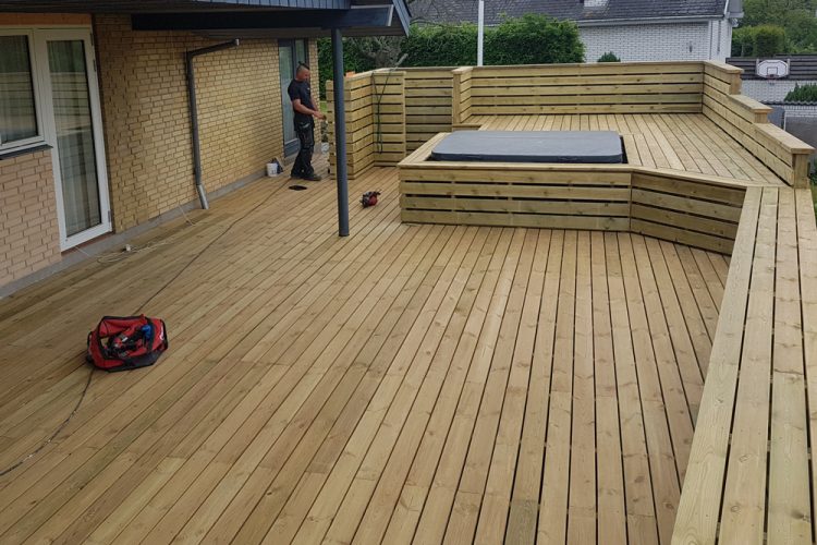 Grand wooden deck with a build in spa.